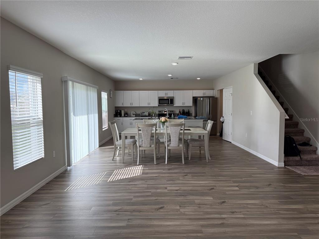 3464 Dahlia Drive Haines City, FL 33844 - Photo 36 of 41 a view of a dining room with furniture and wooden floor