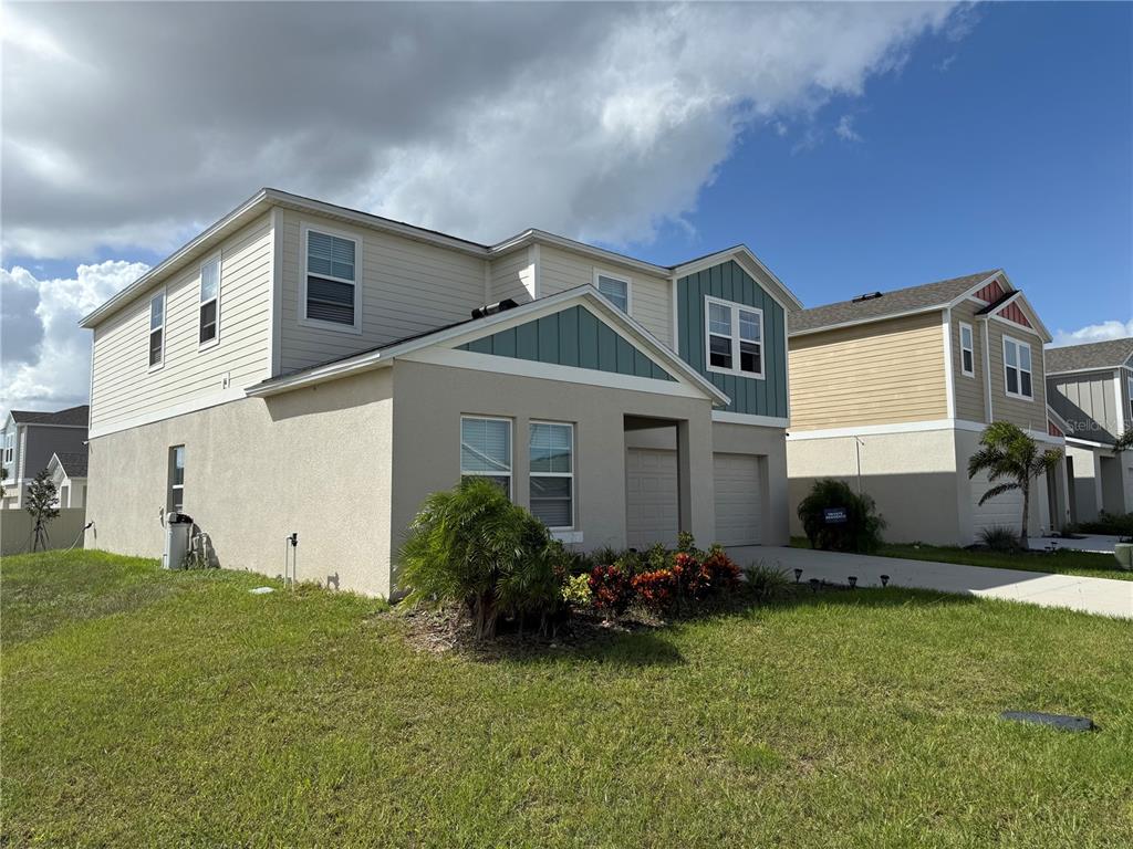 3464 Dahlia Drive Haines City, FL 33844 - Photo 4 of 41 a front view of house with yard and green space
