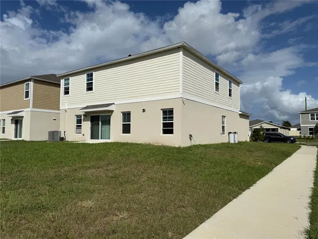 a view of a yard in front of a house