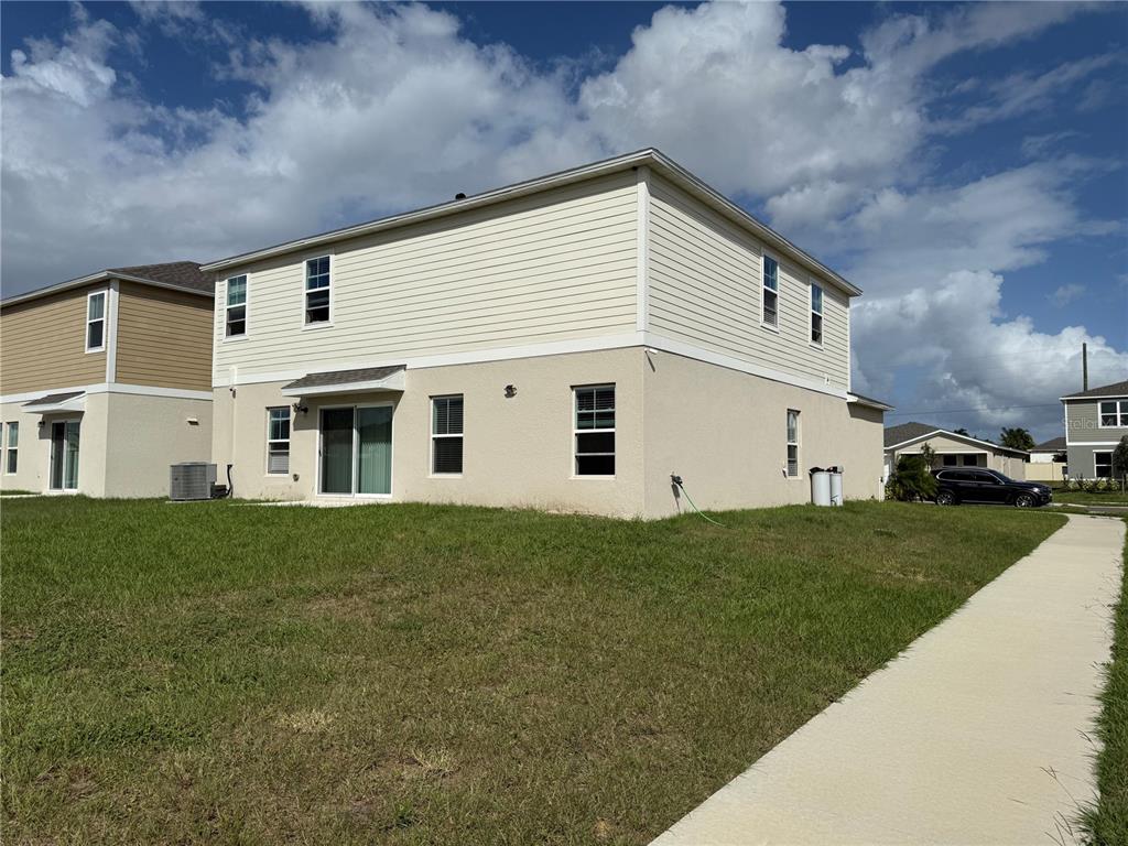3464 Dahlia Drive Haines City, FL 33844 - Photo 5 of 41 a view of a yard in front of a house