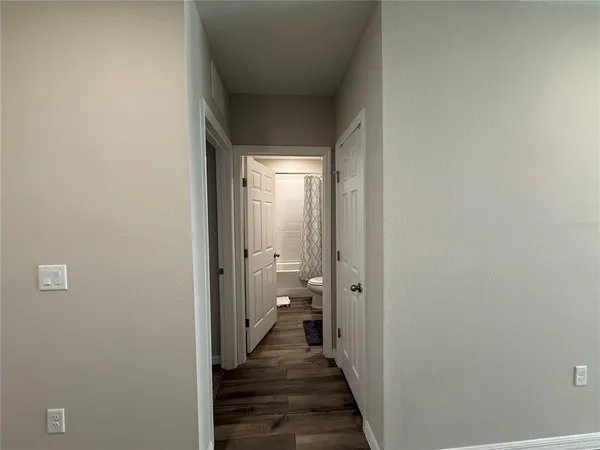 a view of a bathroom from a hallway