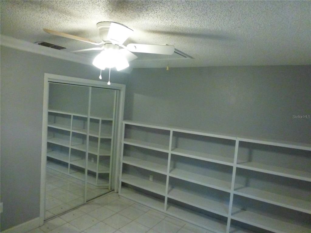 1890 Wolford Road, Unit 5 Clearwater, FL 33760 - Photo 23 of 29 a view of a room with cabinets and closet