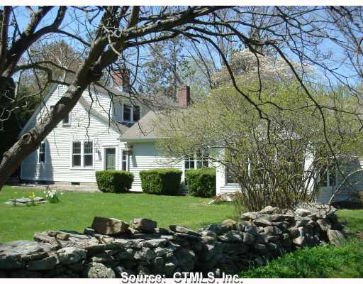 85 Bill Hill Road Lyme, CT 06371 - Photo 1 of 1 Exterior Front. South side of house original house featuring ell addition and facing gardens and views of pasture land.