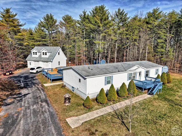 aerial view of a house with large trees