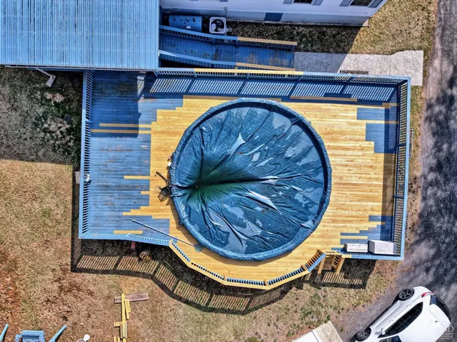 a living room with furniture rug and wooden floor