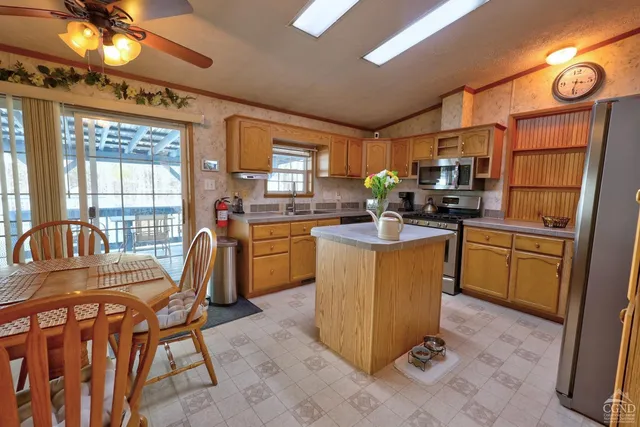 a living room with furniture a window and a fireplace