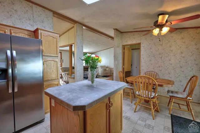 a view of a porch with furniture and wooden floor