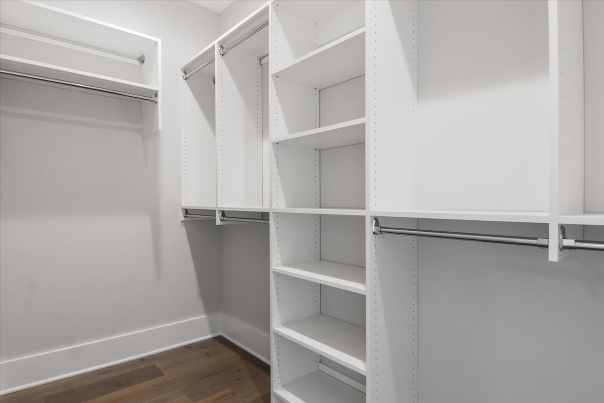 604 Cayman Way Savoy, IL 61874 - Photo 22 of 82 a view of walk in closet with empty racks