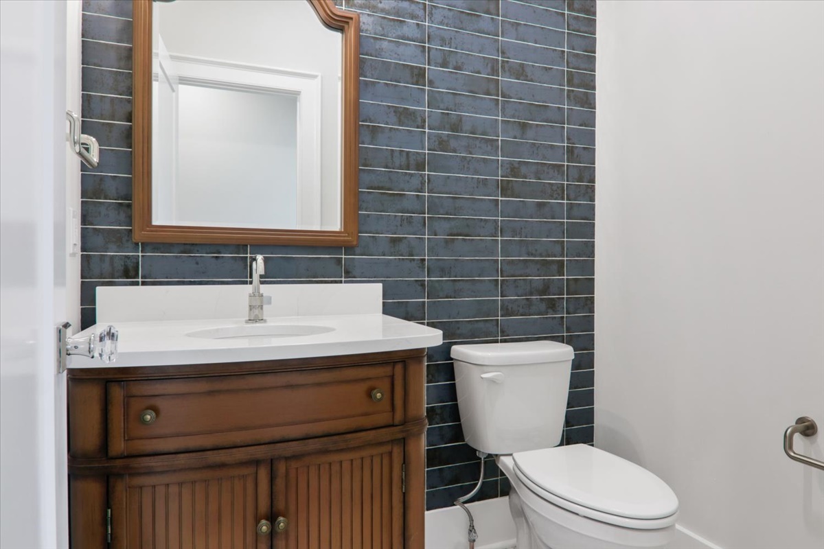 604 Cayman Way Savoy, IL 61874 - Photo 24 of 82 a bathroom with a granite countertop toilet sink and mirror