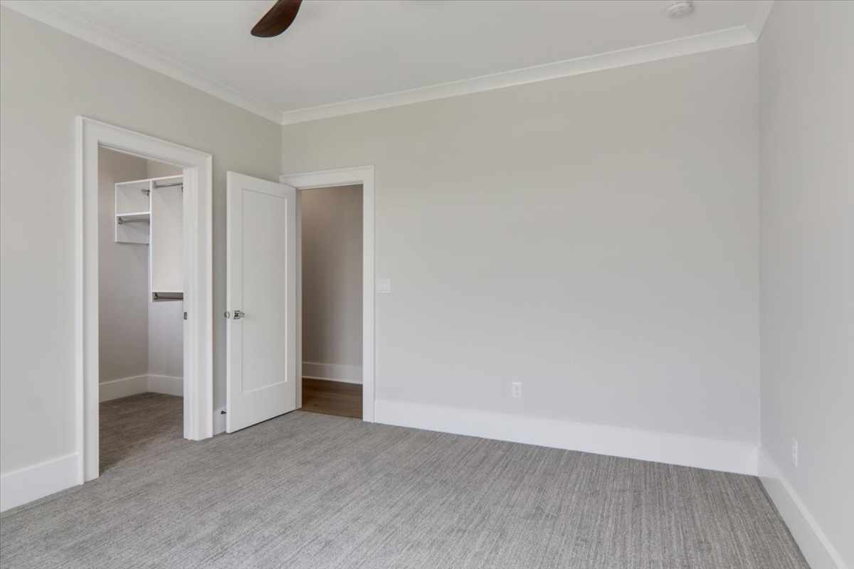 604 Cayman Way Savoy, IL 61874 - Photo 36 of 82 an empty room with a empty space and mirror