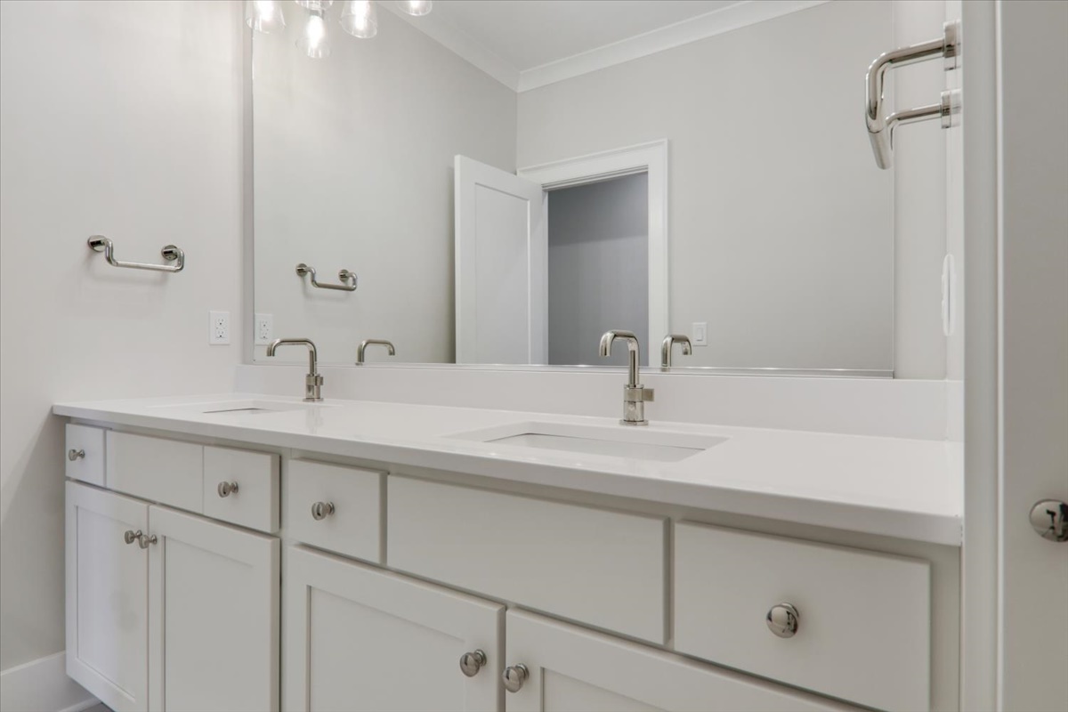 604 Cayman Way Savoy, IL 61874 - Photo 38 of 82 a bathroom with a sink and a mirror