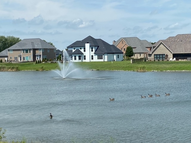 604 Cayman Way Savoy, IL 61874 - Photo 4 of 82 an aerial view of a house with a big yard