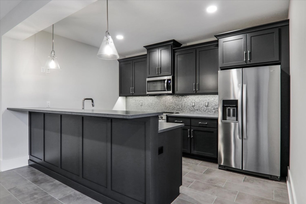 604 Cayman Way Savoy, IL 61874 - Photo 49 of 82 a kitchen with stainless steel appliances a refrigerator and a sink