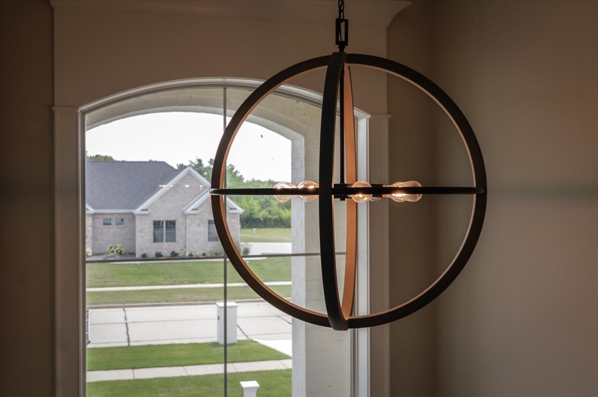 604 Cayman Way Savoy, IL 61874 - Photo 51 of 82 a view of staircase with a floor to ceiling window and a ceiling fan
