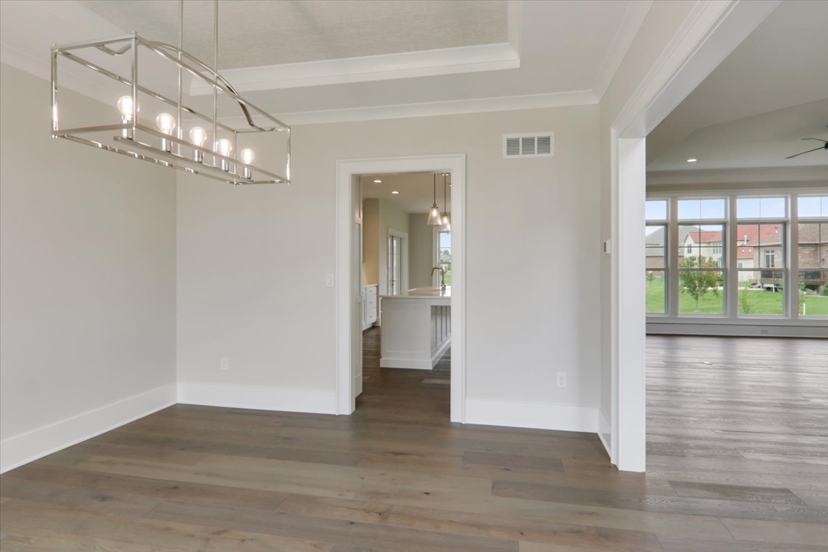 604 Cayman Way Savoy, IL 61874 - Photo 9 of 82 a view of a livingroom with wooden floor and a large window