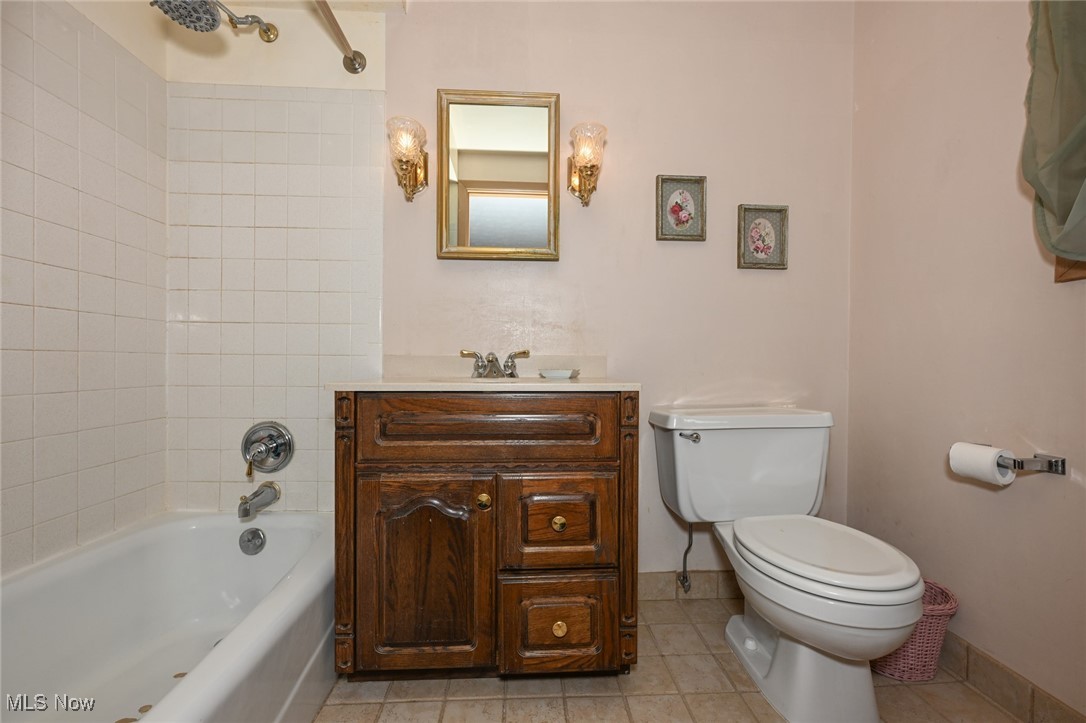 30875 Cannon Road Solon, OH 44139 - Photo 33 of 48 Full bath featuring vanity, shower / bath combination, and ceramic floors