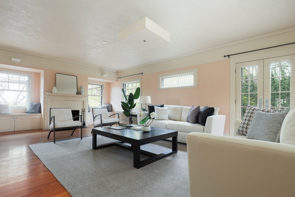 16 Percy Road Lexington, MA 02421 - Photo 12 of 31 a living room with furniture and a fireplace