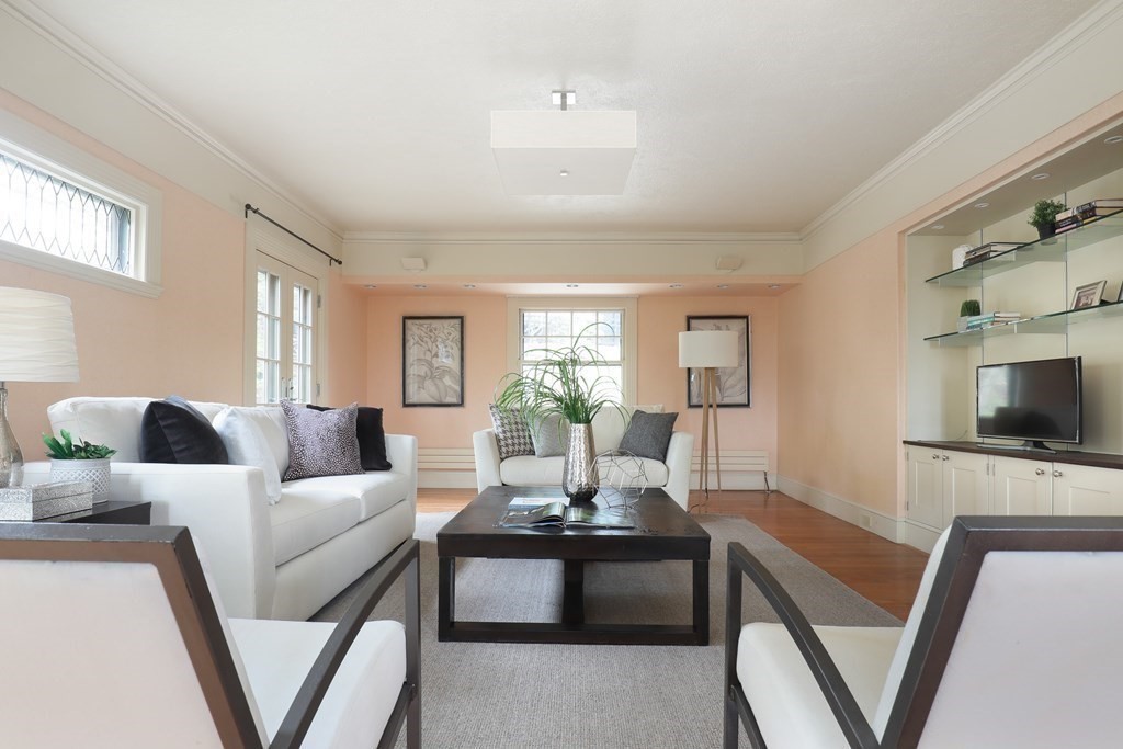 16 Percy Road Lexington, MA 02421 - Photo 14 of 31 a living room with fireplace furniture and a flat screen tv