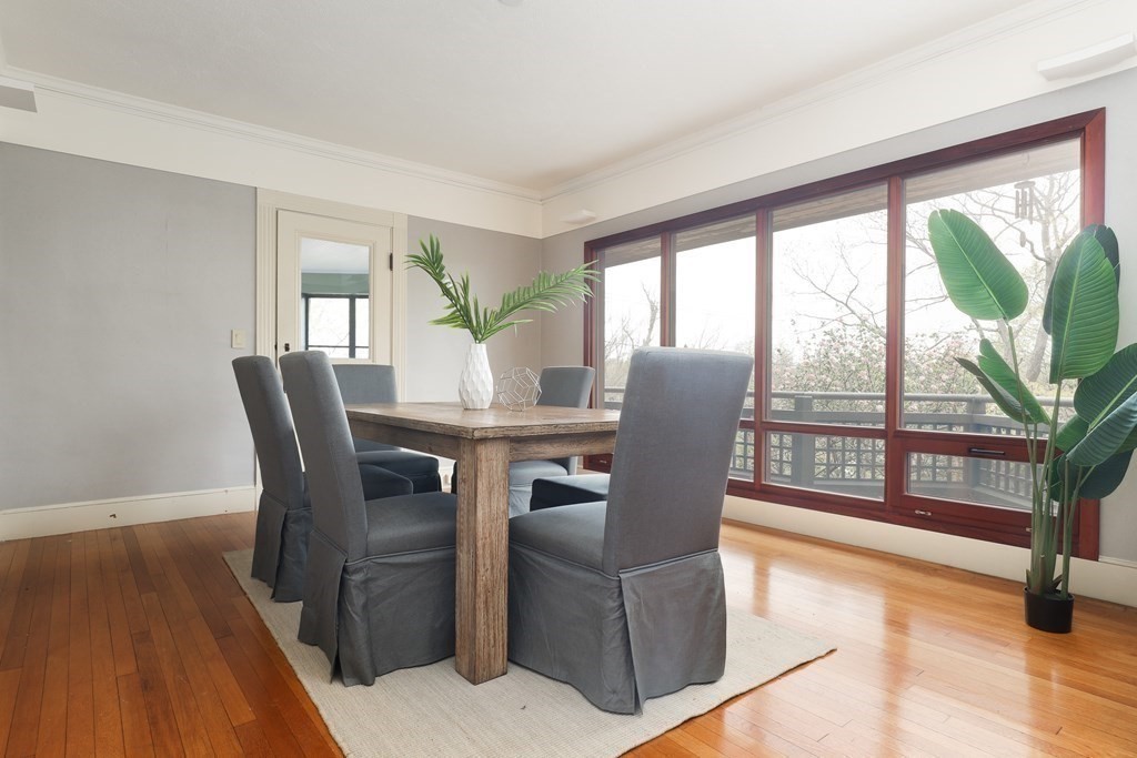 16 Percy Road Lexington, MA 02421 - Photo 16 of 31 a dining room with furniture large windows and wooden floor