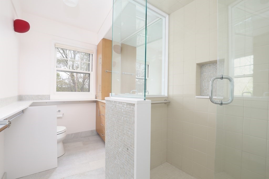 16 Percy Road Lexington, MA 02421 - Photo 24 of 31 a bathroom with a shower and a toilet