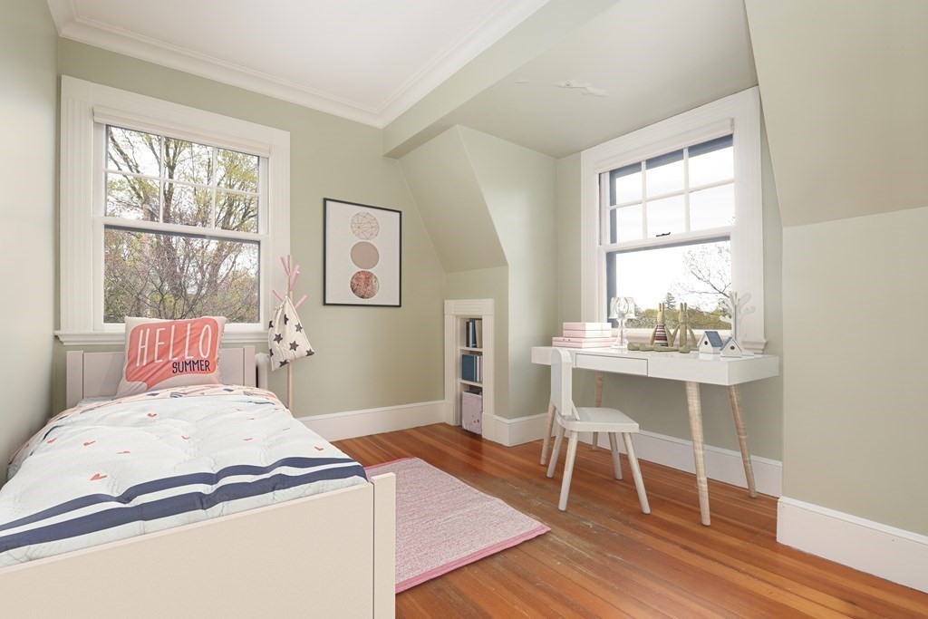 16 Percy Road Lexington, MA 02421 - Photo 26 of 31 a bedroom with a bed and a table chair