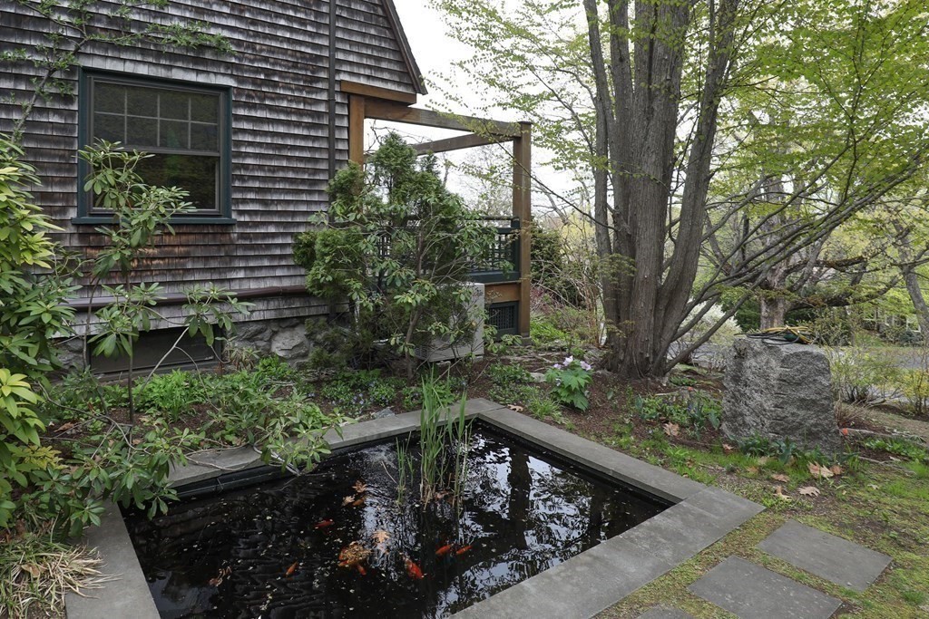 16 Percy Road Lexington, MA 02421 - Photo 4 of 31 a view of a backyard with plants