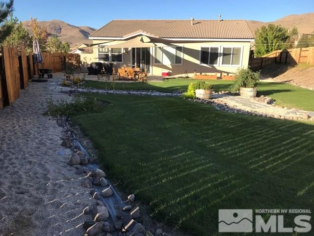 10175 Gold Mine Drive Reno, NV 89521 - Photo 23 of 24 a front view of a house with garden