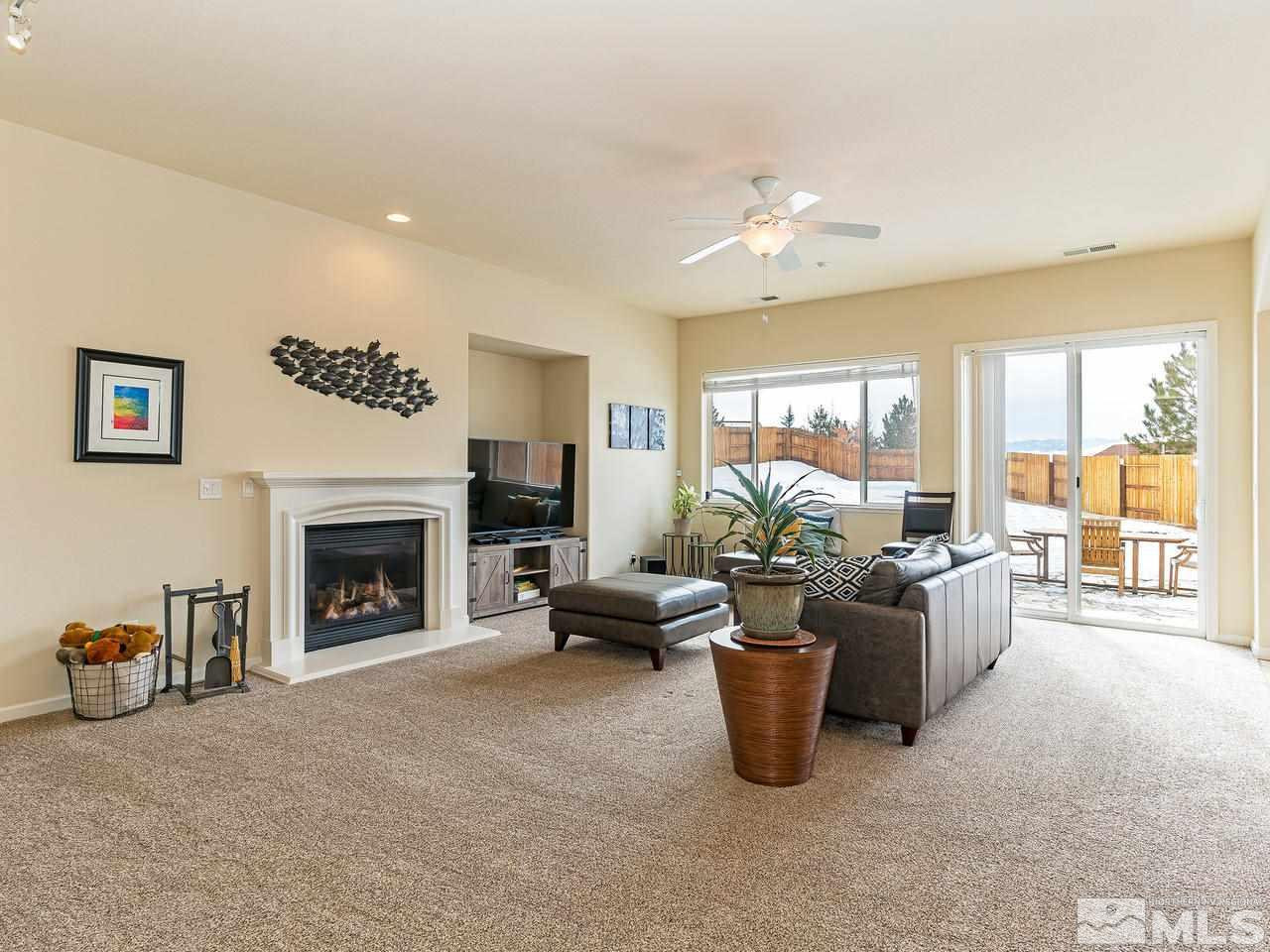 10175 Gold Mine Drive Reno, NV 89521 - Photo 4 of 24 a living room with furniture and a fireplace
