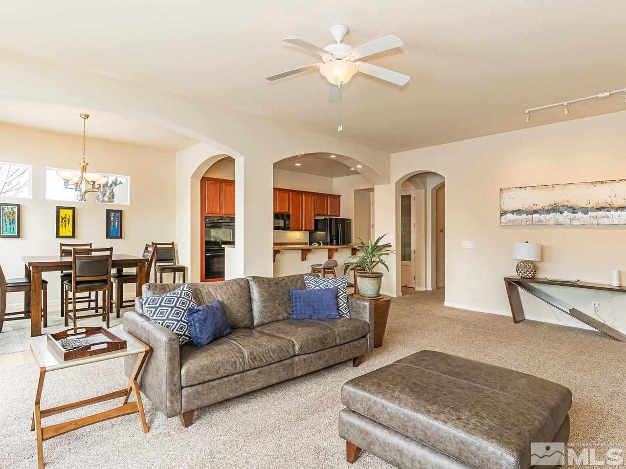 10175 Gold Mine Drive Reno, NV 89521 - Photo 5 of 24 a living room with furniture and a chandelier