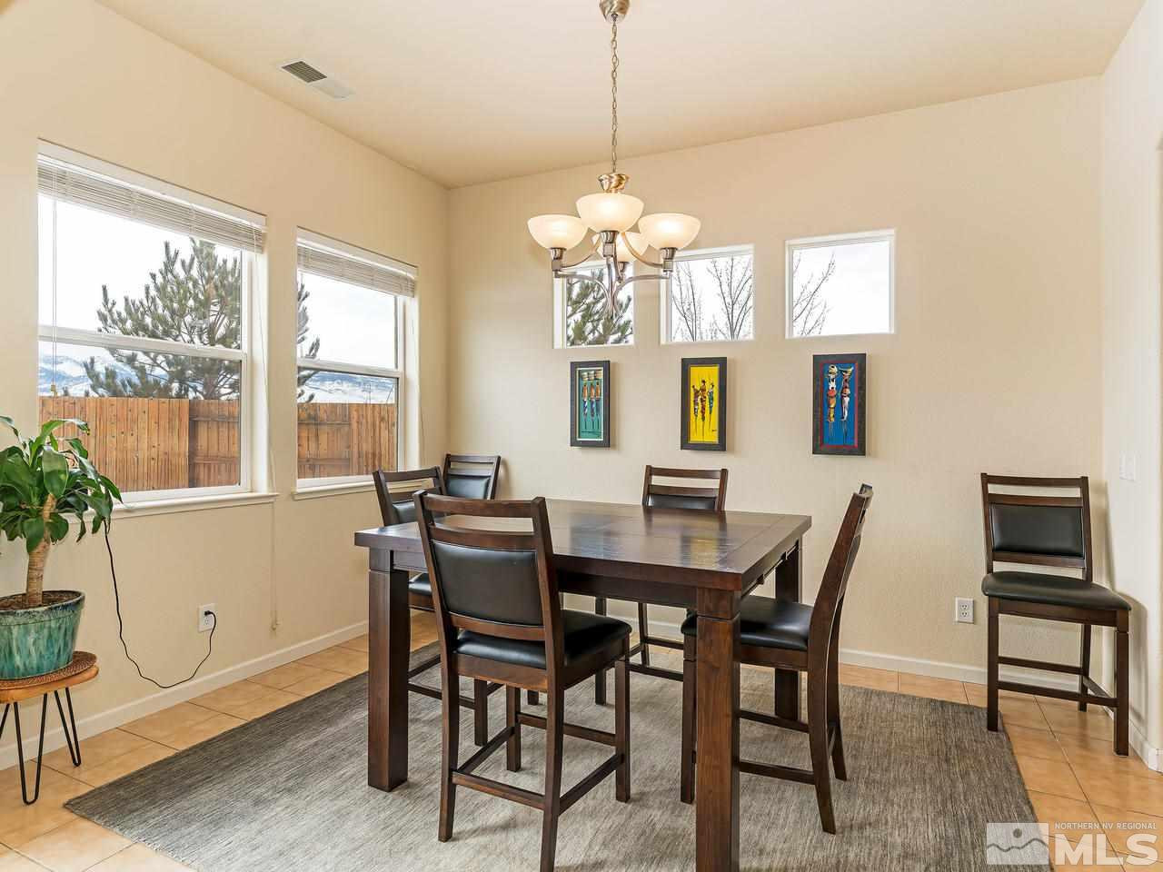 10175 Gold Mine Drive Reno, NV 89521 - Photo 7 of 24 a view of a dining room with furniture window and outside view