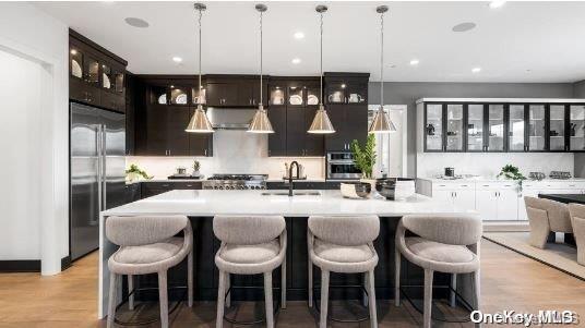 18 Sequoia Circle Manhasset, NY 11030 - Photo 3 of 6 a large kitchen with a table and chairs