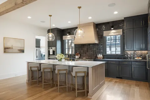 a view of a dining room with furniture wooden floor and chandelier