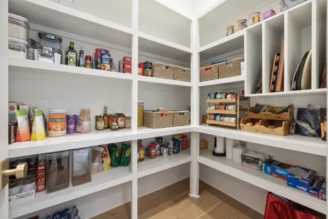 a en suite bathroom with a double vanity sink and a mirror
