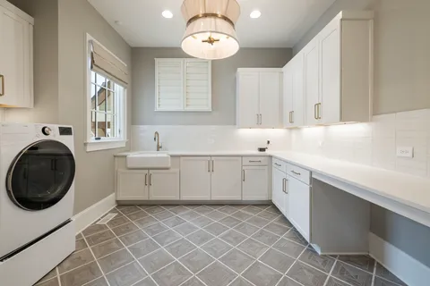 a bed room with a bed couches and a flat tv screen