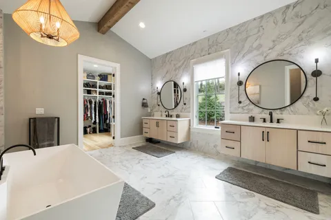 an aerial view of a house with a yard and outdoor seating