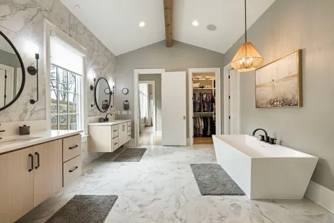 an aerial view of a house with a big yard and sitting area