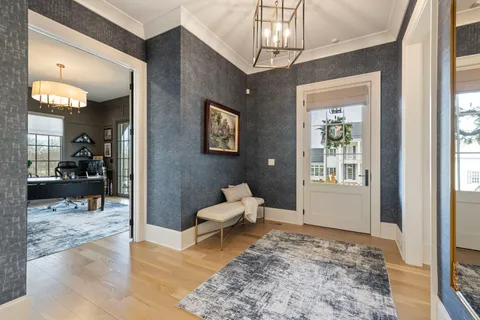 a bedroom with a large bed and a large window