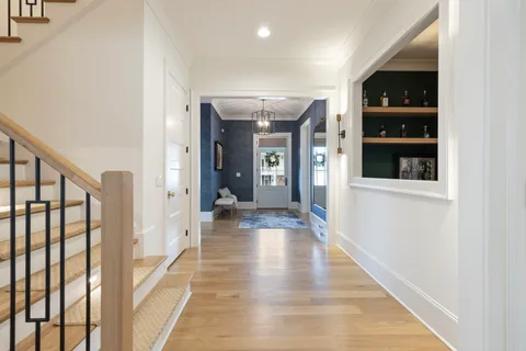 a spacious bedroom with a large bed and a flat screen tv