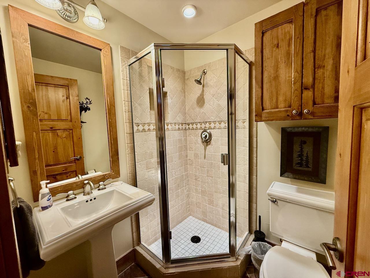 9 Hunter Hill Road, Unit 205 Crested Butte, CO 81225 - Photo 21 of 28 a bathroom with a sink a toilet and shower