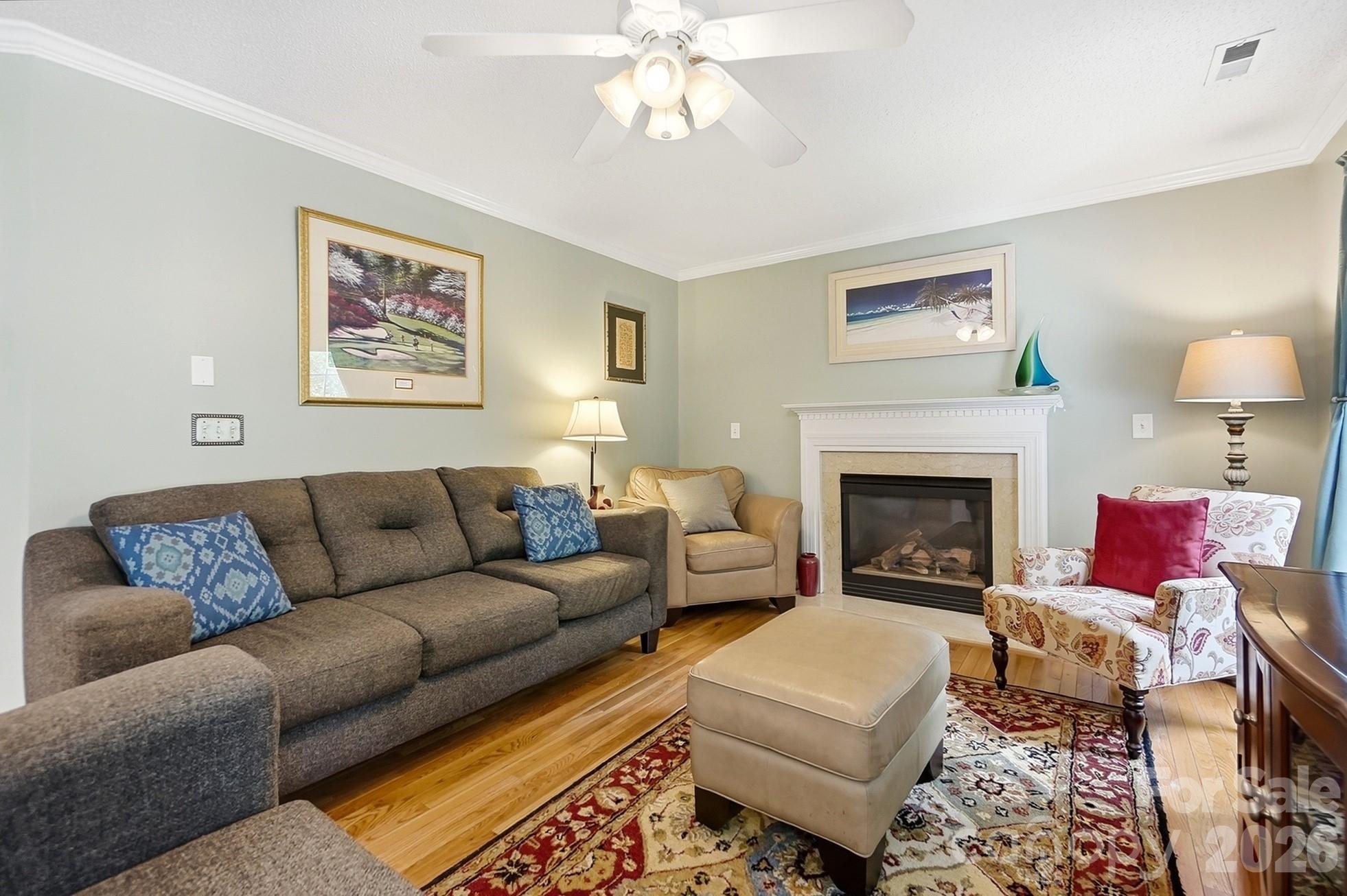 442 Sugar Maple Drive Tega Cay, SC 29708 - Photo 7 of 48 a living room with furniture and a fireplace