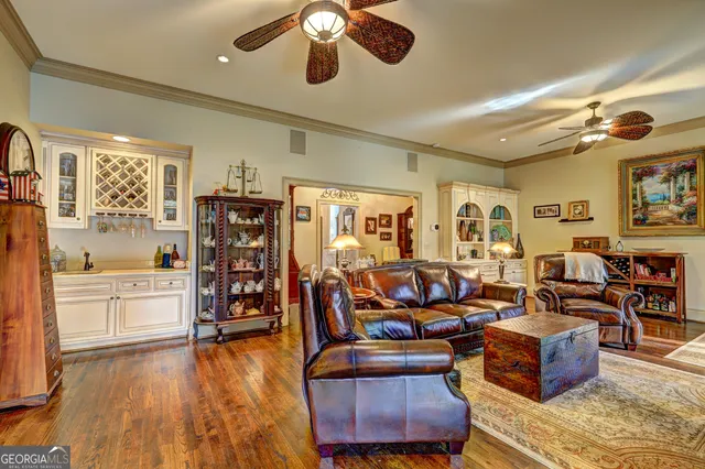 a view of a dining room with furniture and chandelier
