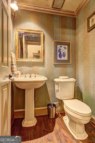 a workspace with wooden floor and a window