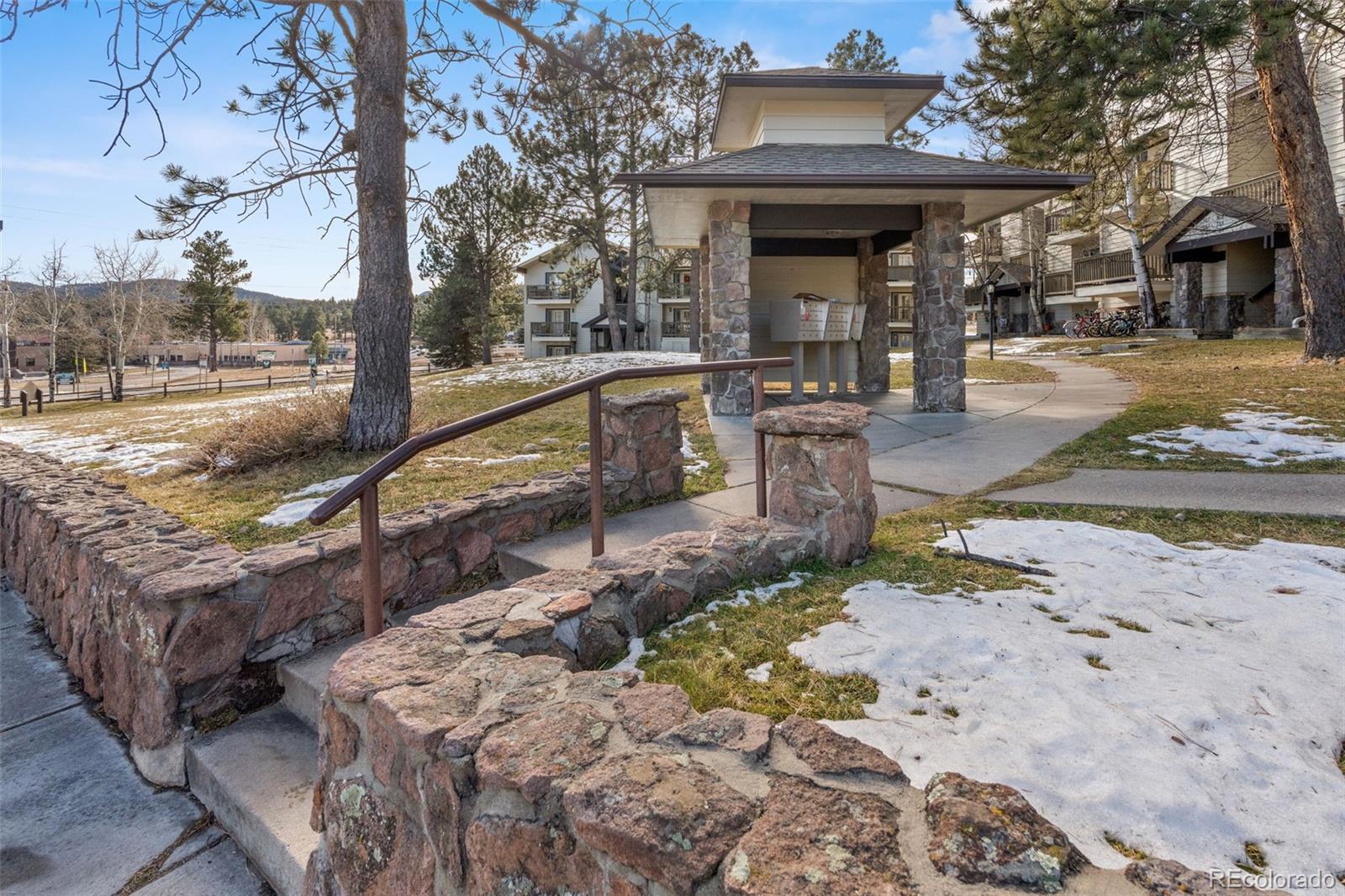 29656 Buffalo Park Road, Unit 206 Evergreen, CO 80439 - Photo 20 of 30 a view of a park with iron fence