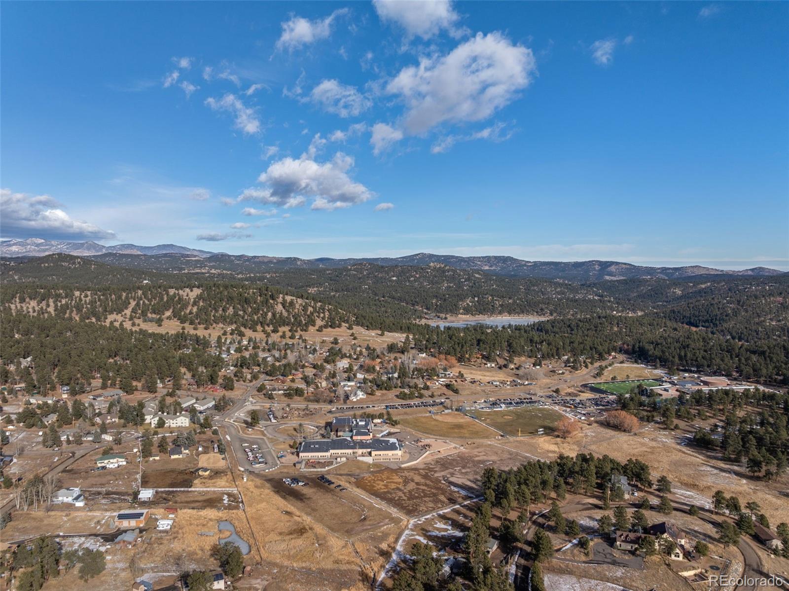 29656 Buffalo Park Road, Unit 206 Evergreen, CO 80439 - Photo 29 of 30 a view of a lake with mountains in the background