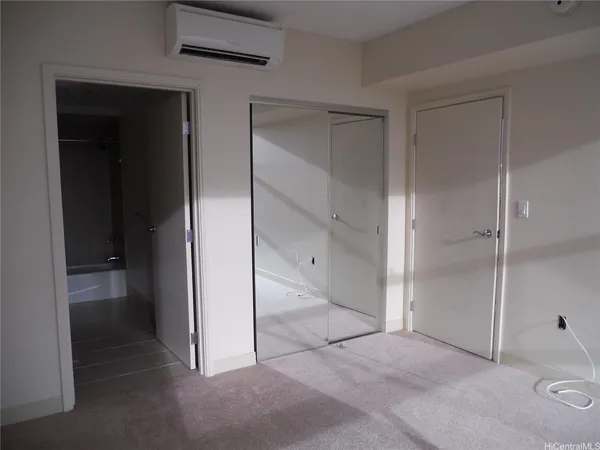 a kitchen with granite countertop a sink refrigerator and microwave