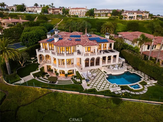 an aerial view of multiple houses with yard