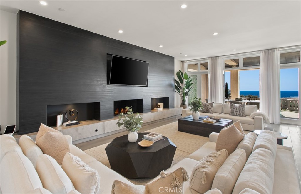 22 Pelican Crest Drive Newport Coast, CA 92657 - Photo 11 of 66 a living room with furniture fireplace and a flat screen tv