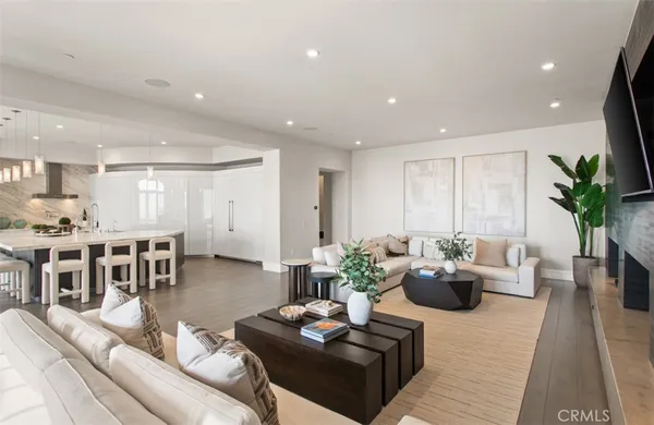 a kitchen with stainless steel appliances kitchen island granite countertop a table and chairs