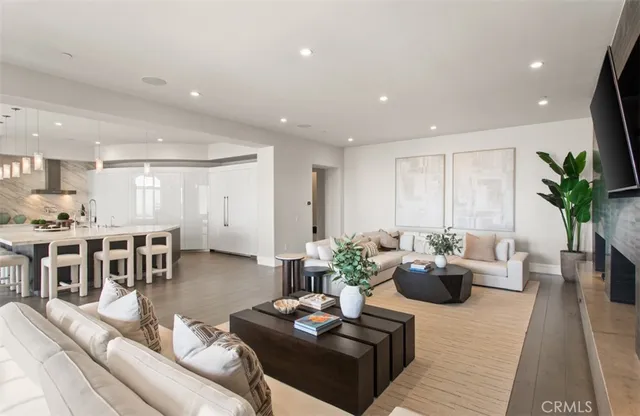 a kitchen with stainless steel appliances granite countertop a table and chairs