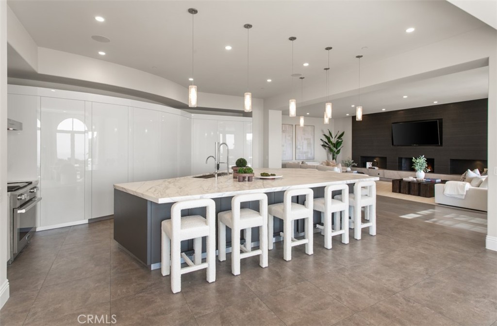 22 Pelican Crest Drive Newport Coast, CA 92657 - Photo 14 of 66 a large kitchen with a table and chairs